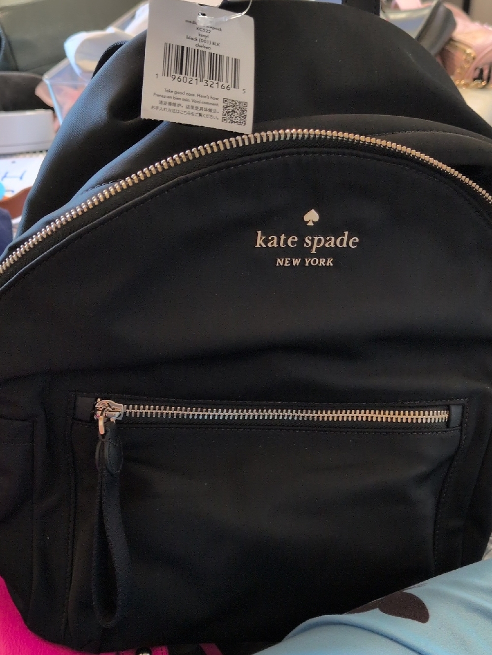 kate spade black backpack with gold hardware